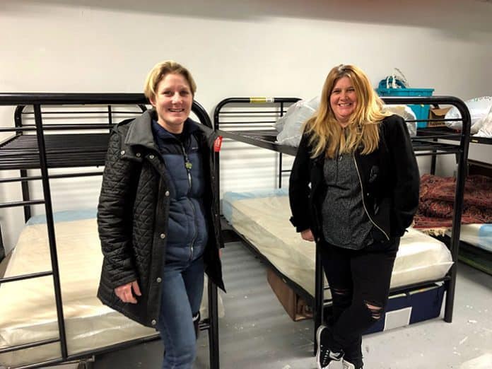 Seeds Of Service Executive Director Christie Winters, left, and Moira Edge, who runs the Bay store are in a room that will temporarily house volunteers who come to help with their mission. (Photo by Judy Smestad-Nunn)