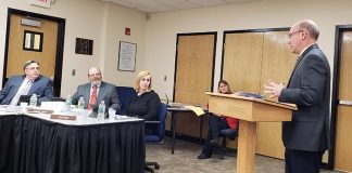 John Swisher of the auditing firm Suplee, Clooney and Company, Westfield, addresses the Jackson Board of Education about its finances and audit during a recent meeting of the school board. (Photo by Bob Vosseller)