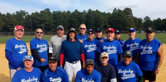 The Jersey Blues of the Berkeley Senior Softball League enjoy their fall title. Kneeling from left to right are Albie Garzoni, Ed De Francesco, Robert Martin, Jimmy Conner and Kelly Rielly. Standing from left to right are Rodney Ford, Al Switka, Jon Rasmussen, Dale Cammarata, Randy Leiser, Ron Castellano, Matt Baranyah, Joe Heckendorf (wearing the red hat), Matt Padulla, Billy Vanderstreet and Jim Dixon. Another team member was Mike Warner. (Photo courtesy of John Dowling)