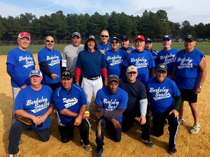 The Jersey Blues of the Berkeley Senior Softball League enjoy their fall title. Kneeling from left to right are Albie Garzoni, Ed De Francesco, Robert Martin, Jimmy Conner and Kelly Rielly. Standing from left to right are Rodney Ford, Al Switka, Jon Rasmussen, Dale Cammarata, Randy Leiser, Ron Castellano, Matt Baranyah, Joe Heckendorf (wearing the red hat), Matt Padulla, Billy Vanderstreet and Jim Dixon. Another team member was Mike Warner. (Photo courtesy of John Dowling)