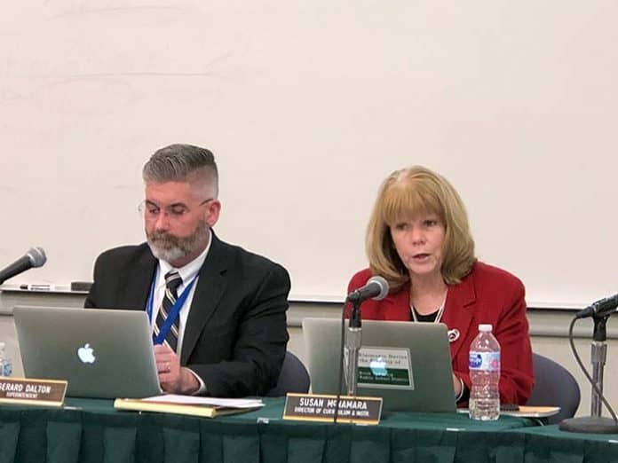 Susan McNamara, Director of Planning, Research and Evaluation, discusses district goals, sitting beside Superintendent Gerard Dalton. (Photo by Judy Smestad-Nunn)