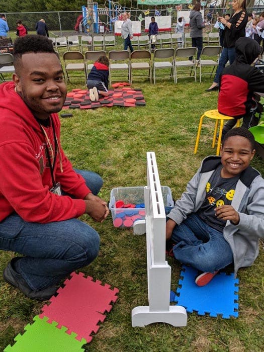 Paraprofessional JaQuinn Robinson and student Devon Boswell enjoy the strategy station of the Bulldog Retreat. (Photo courtesy Skye Donzelli)