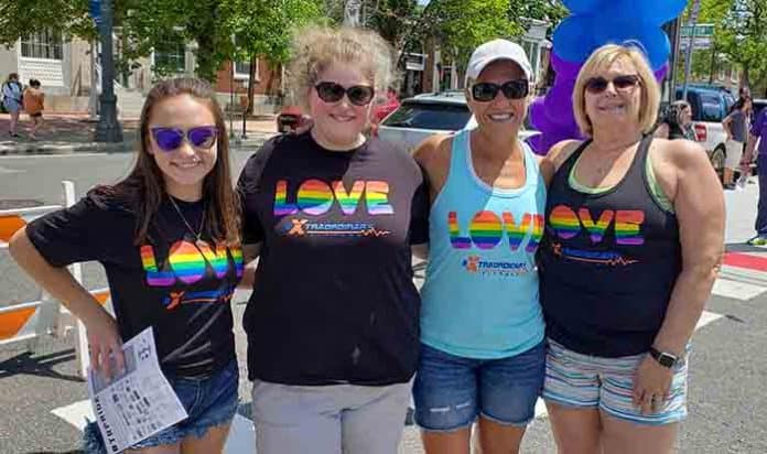 Juliana Lamonica, left, joins Justine Applegate, Petra LaMonica and Doreen Applegate in their matching shirts provided by Extraordinary Fitness in Toms River at the Toms River Pride Day. (Photo by Bob Vosseller)