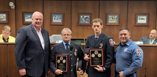 From left to right, Lacey Township Mayor Timothy McDonald, Lanoka Harbor Fire Company President Edward Barker, Forked River Firefighter Edward Barker, Jr., and Police Chief Michael C. DiBella, during the July 11, 2019 Lacey Township meeting. The police department recognized the efforts of both men related to a December 2018 water rescue. (Photo courtesy Lacey Township Police)