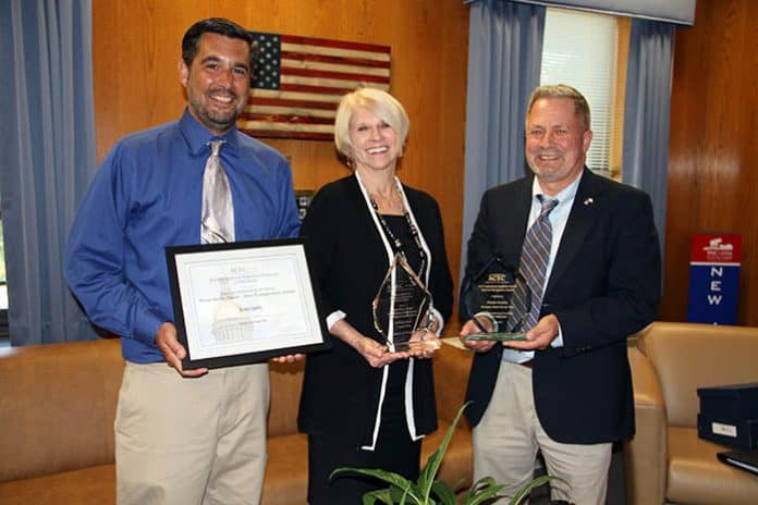 Displaying some of the awards garnered by the design and redevelopment of the John C. Bartlett Jr. County Park at Berkeley Island are from left to right, Joseph A. Pirozek, Ocean County Department of Parks and Recreation, Ocean County Freeholder Director Virginia E. Haines, Chairwoman of the Ocean County Department of Parks and Recreation and Michael T. Mangum, Director of the Ocean County Department of Parks and Recreation. (Photo courtesy Ocean County)