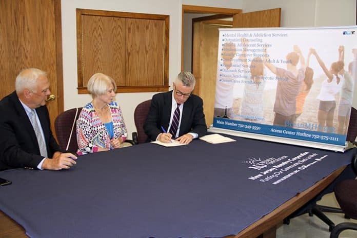 Participating in the signing of the Memorandum of Understanding are from left to right Ocean Mental Health Services Chief Executive Officer James M. Cooney, Ocean County Freeholder Director Virginia E. Haines, and New Jersey Reentry Corporation Executive Director Jim McGreevey. (Photo courtesy Ocean County)